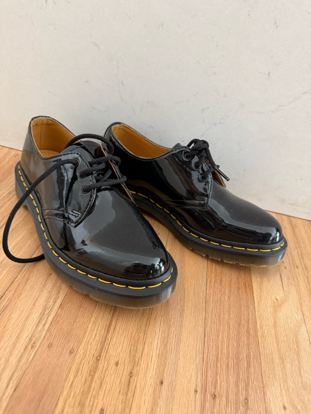 Dr. Marten’s Patent Black Lace-Up Flats with Yellow Stitch Detail